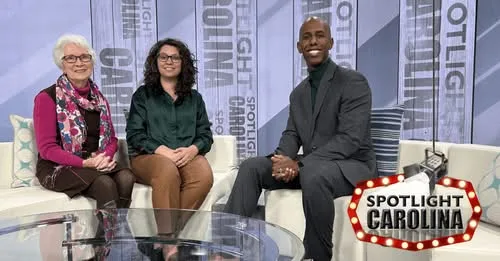 Three people on Spotlight Carolina TV set