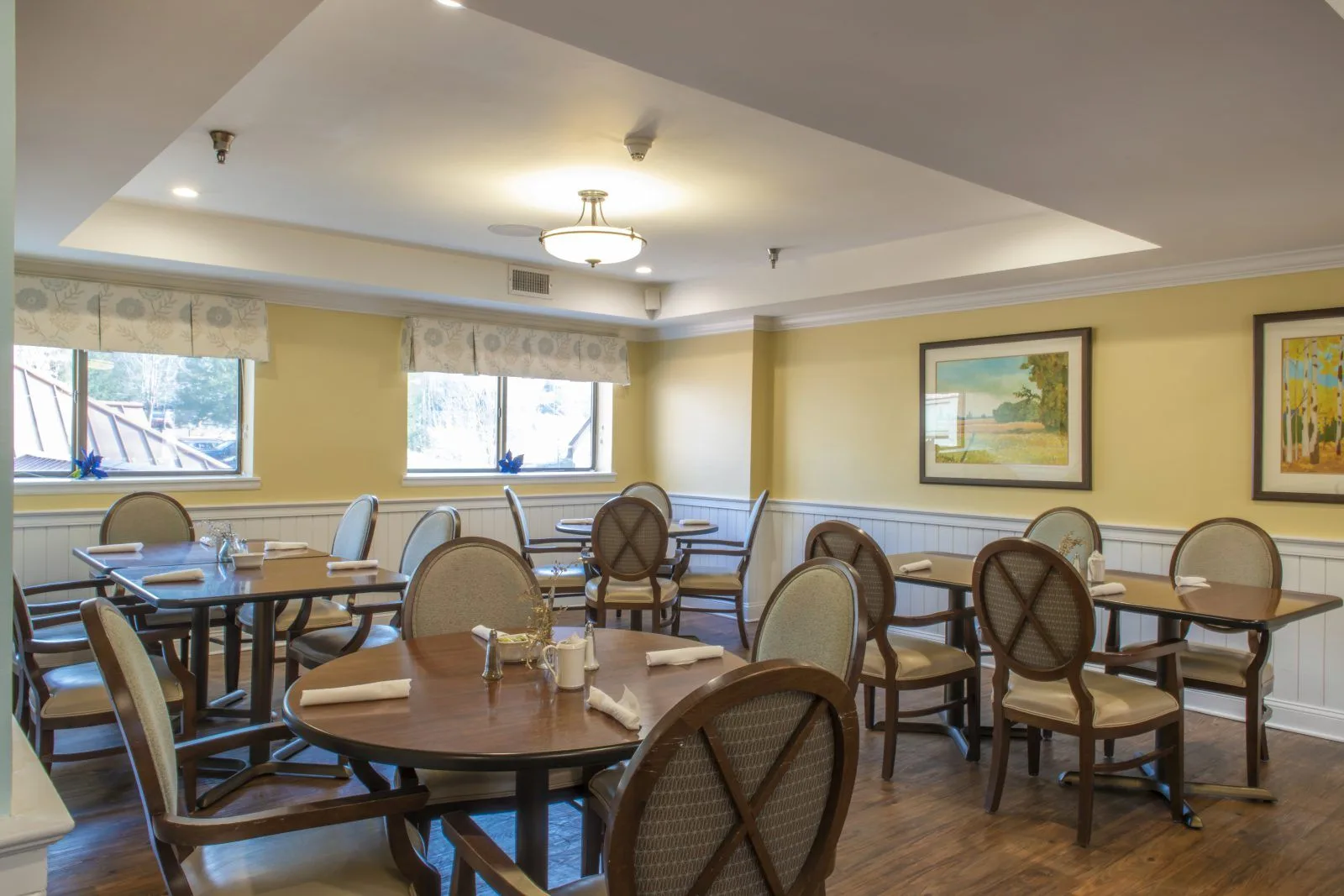 Cozy dining room with wooden tables and chairs