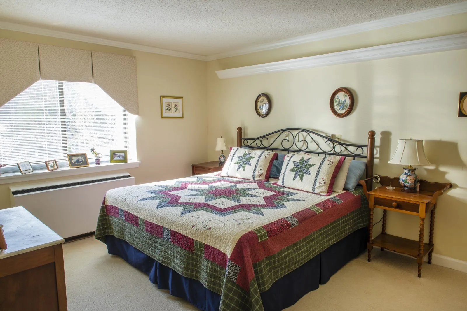 Cozy bedroom with quilted bedspread and window light